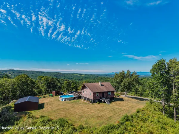 an outdoor sitting area with furniture in backyard