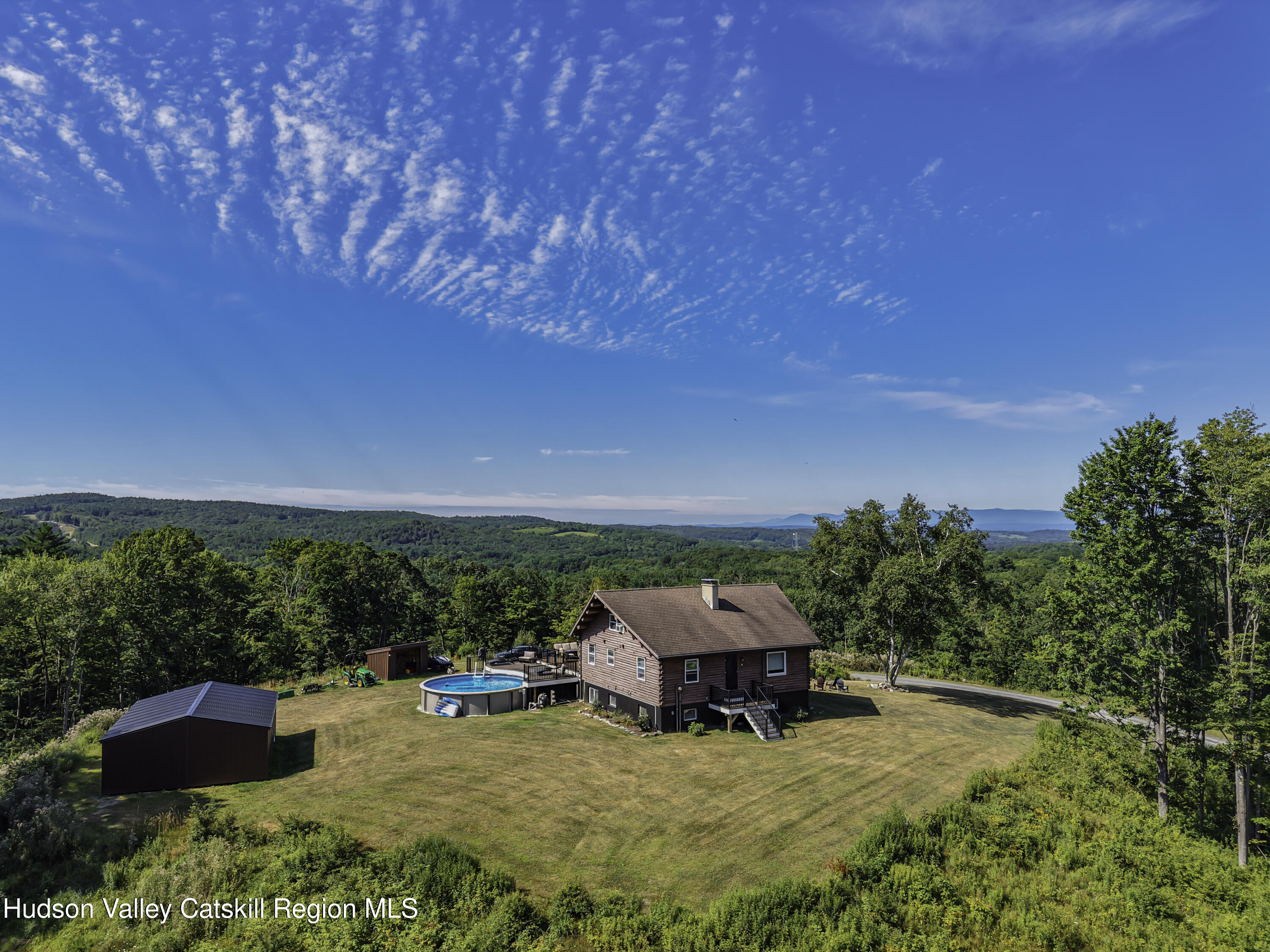 10 7 Bridges Road Old Chatham, NY 12136 - Photo 1 of 42 an outdoor sitting area with furniture in backyard