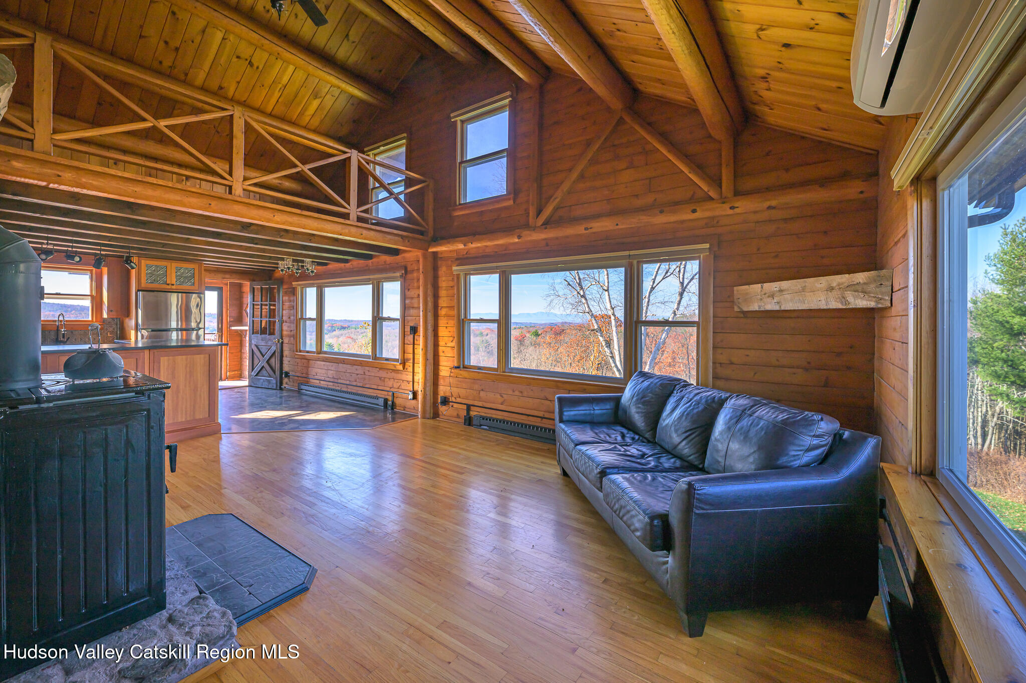 10 7 Bridges Road Old Chatham, NY 12136 - Photo 21 of 42 a living room with furniture and a large window
