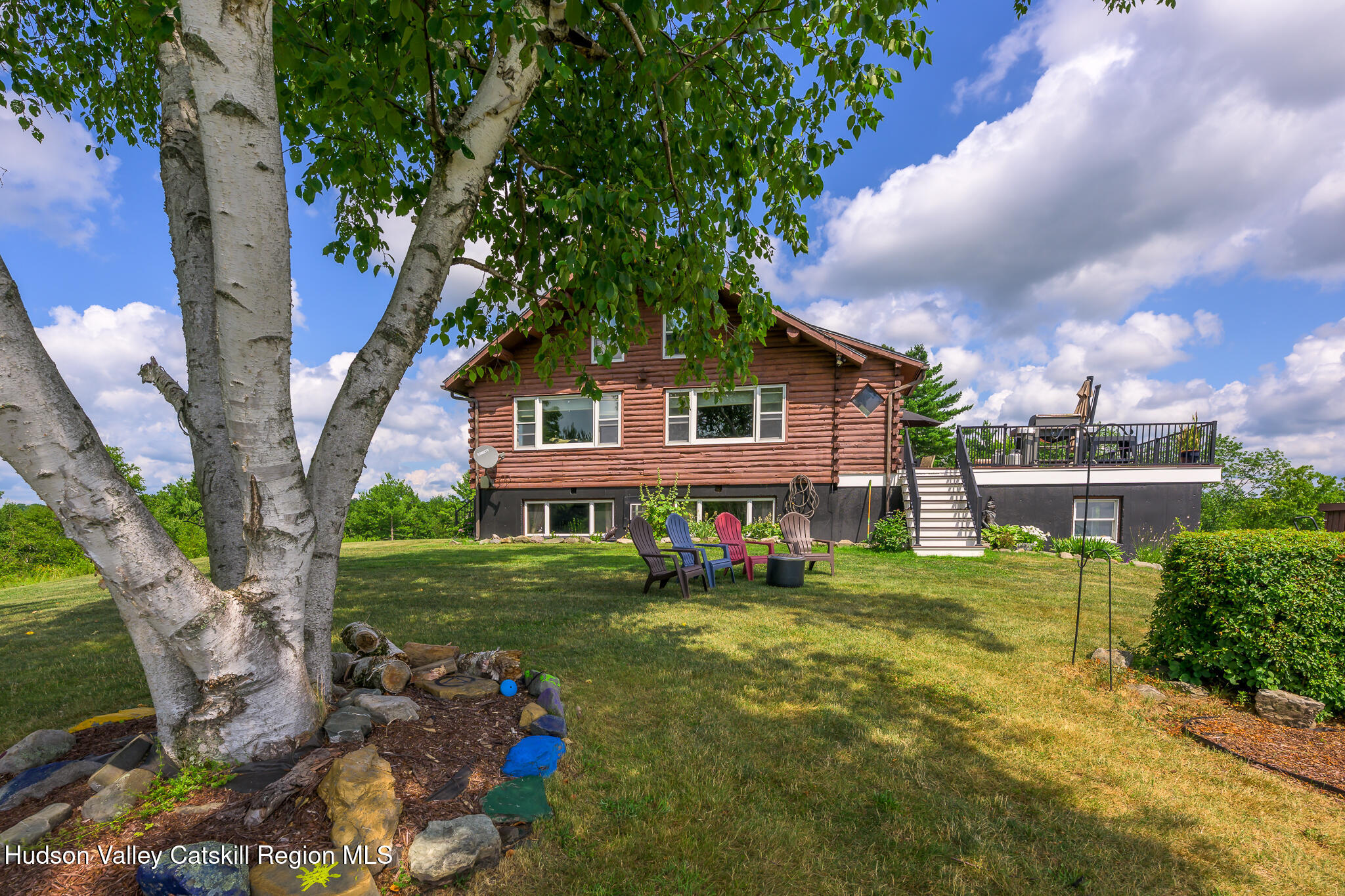 10 7 Bridges Road Old Chatham, NY 12136 - Photo 37 of 42 a view of a house with a big yard and large trees