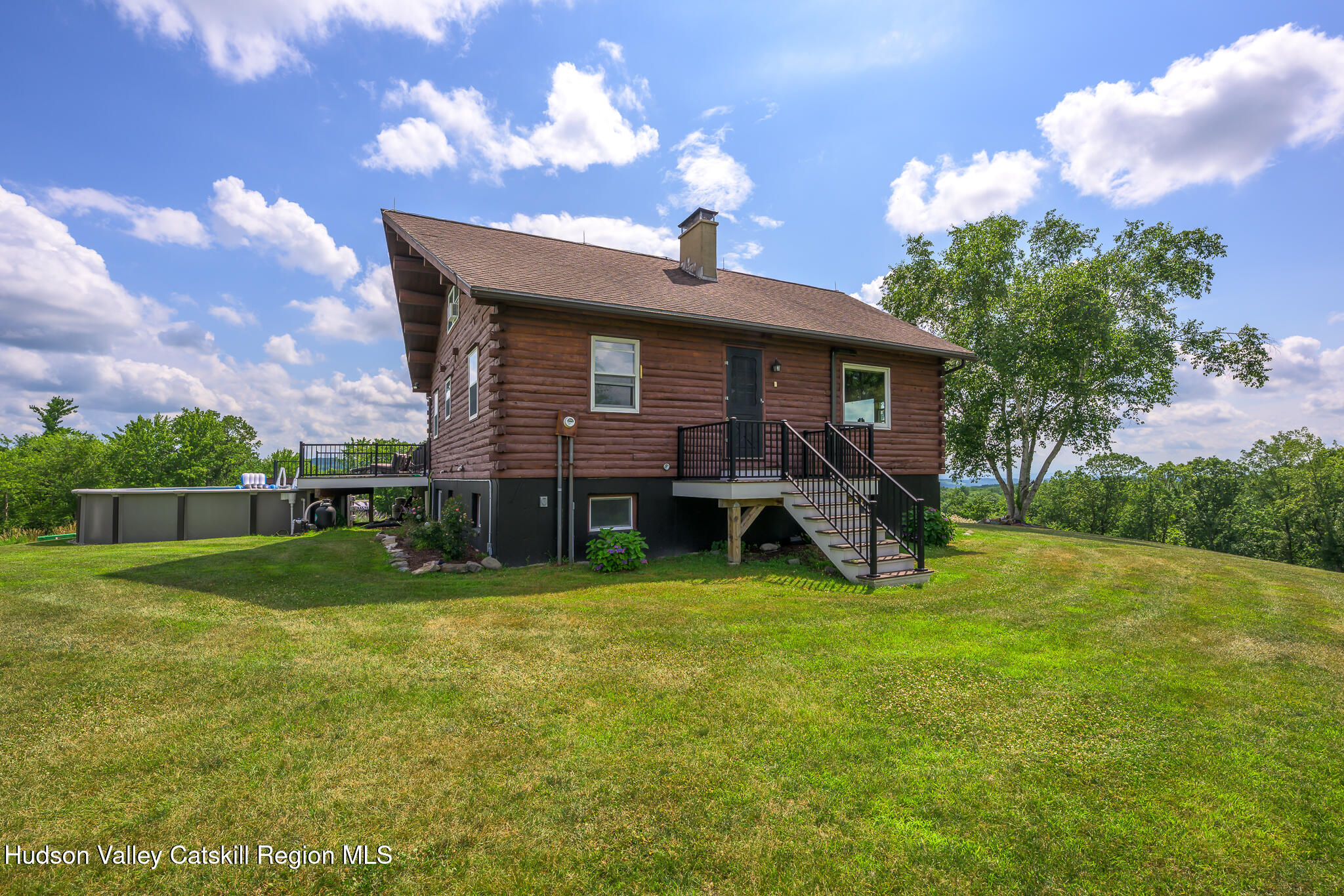 10 7 Bridges Road Old Chatham, NY 12136 - Photo 40 of 42 a view of a house with a yard porch and sitting area