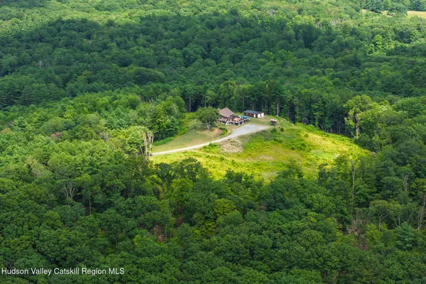 an aerial view of a house with outdoor space