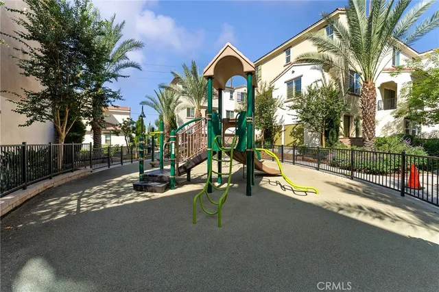 a view of a park with swings and slides