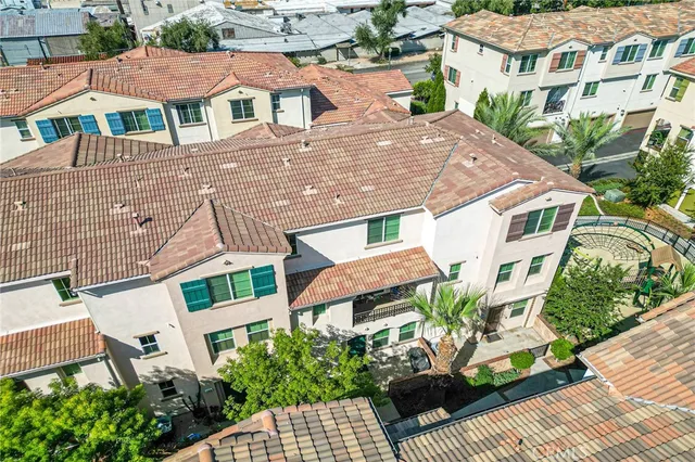 a aerial view of a house with a yard