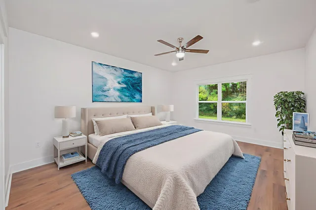 a bed room with a bed and a window