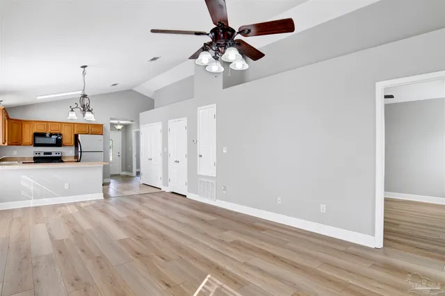 a view of a kitchen with a sink and a window