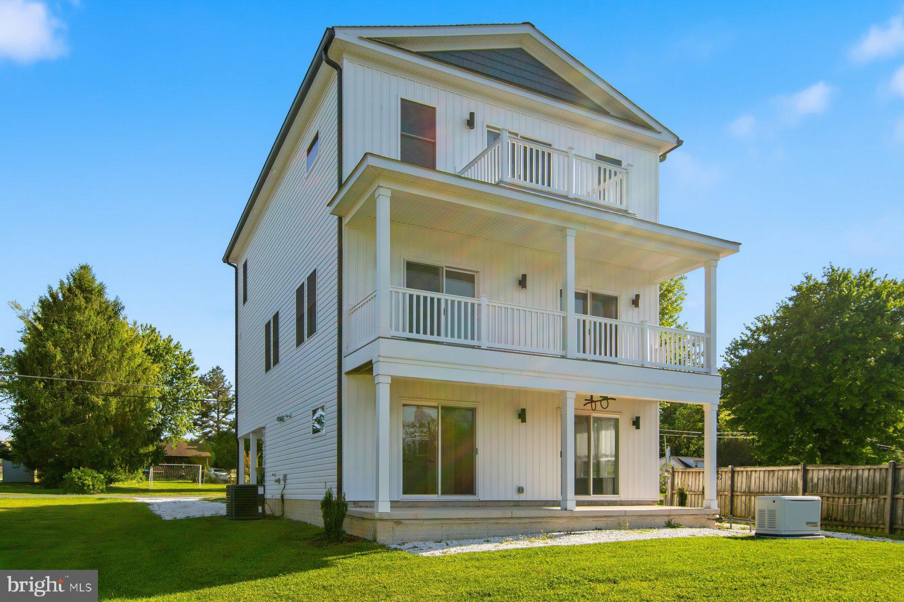 11030 Bird River Grove Road White Marsh, MD 21162 - Photo 4 of 53 a front view of a house with a yard