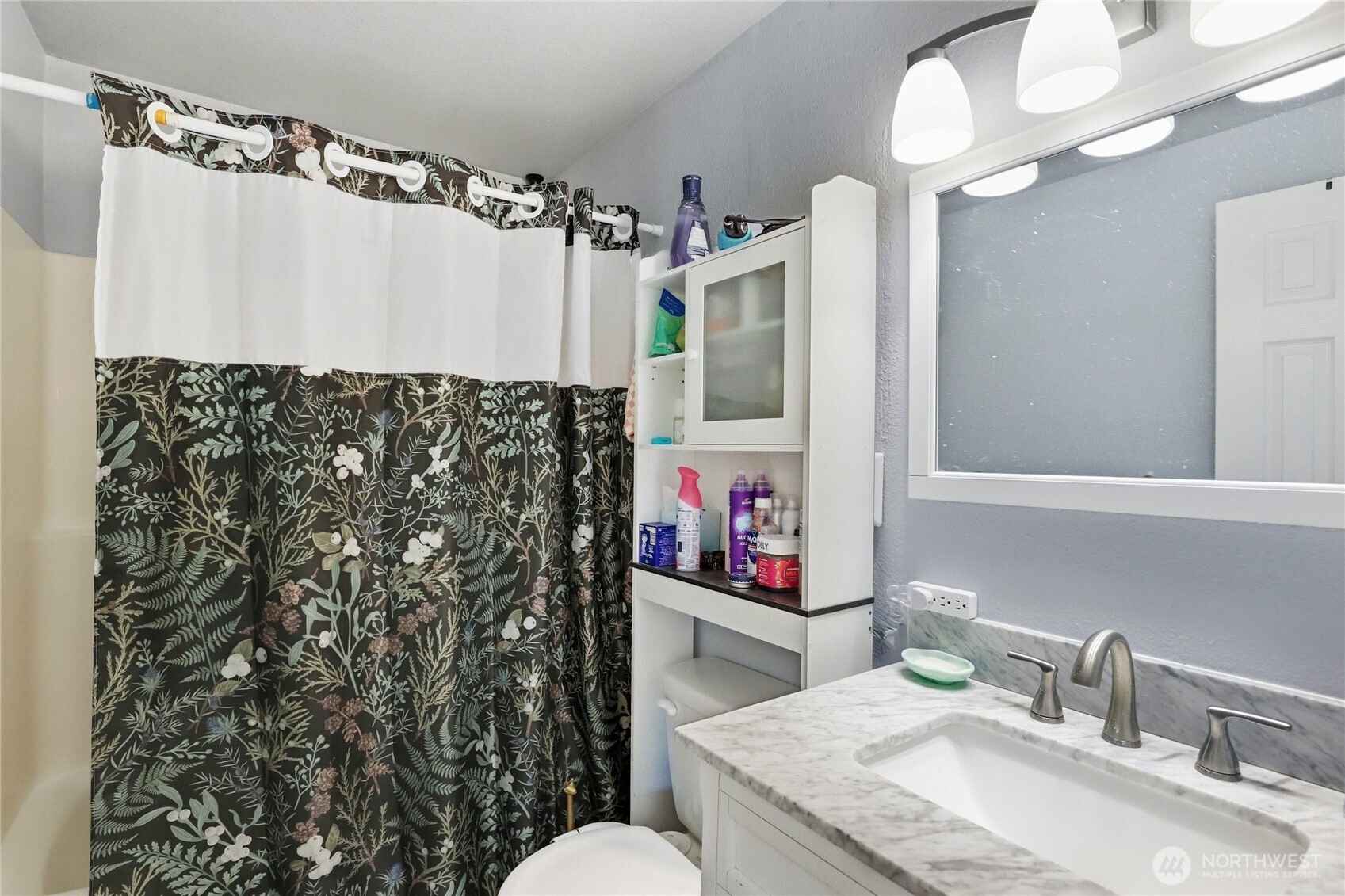 2533 Fir Avenue Bremerton, WA 98310 - Photo 18 of 38 a bathroom with a sink vanity mirror and shower