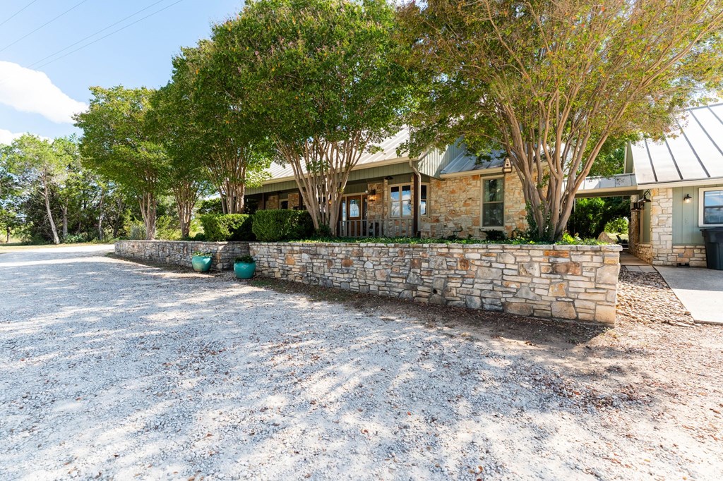 43 High Street Road Comfort, TX 78013 - Photo 11 of 90 a front view of a house with a yard and garage
