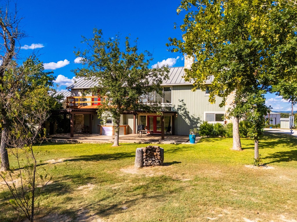 43 High Street Road Comfort, TX 78013 - Photo 14 of 90 a view of a swimming pool with an outdoor space and seating area