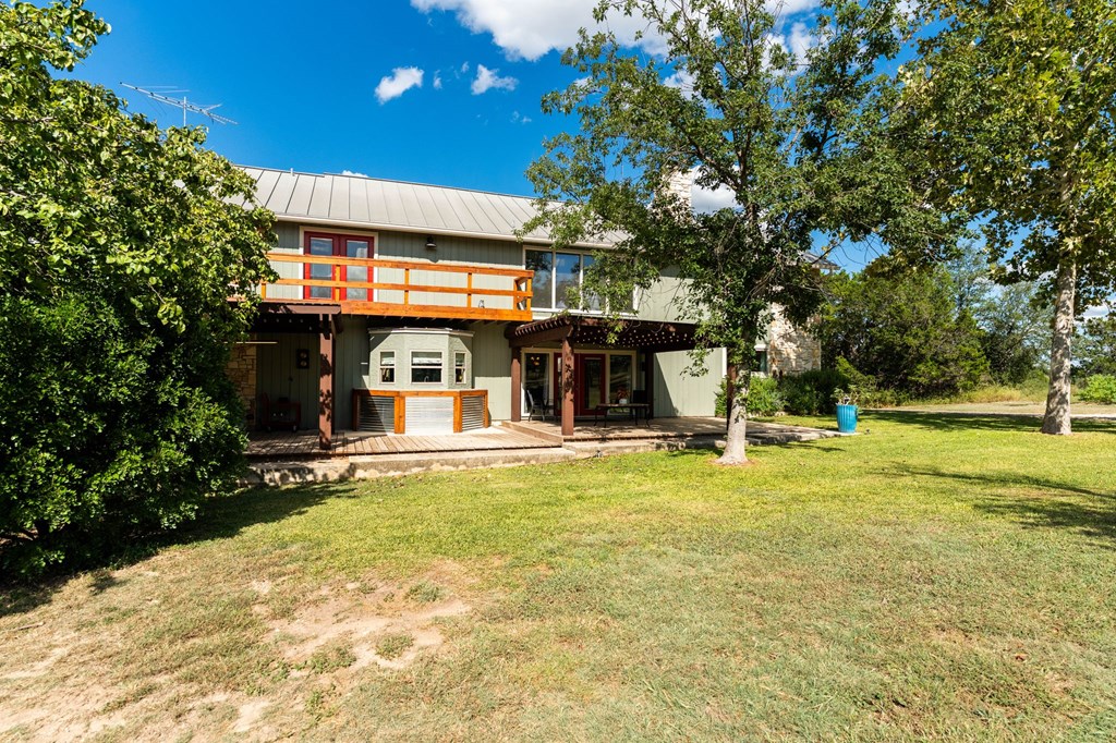 43 High Street Road Comfort, TX 78013 - Photo 15 of 90 a view of a house with swimming pool and sitting area