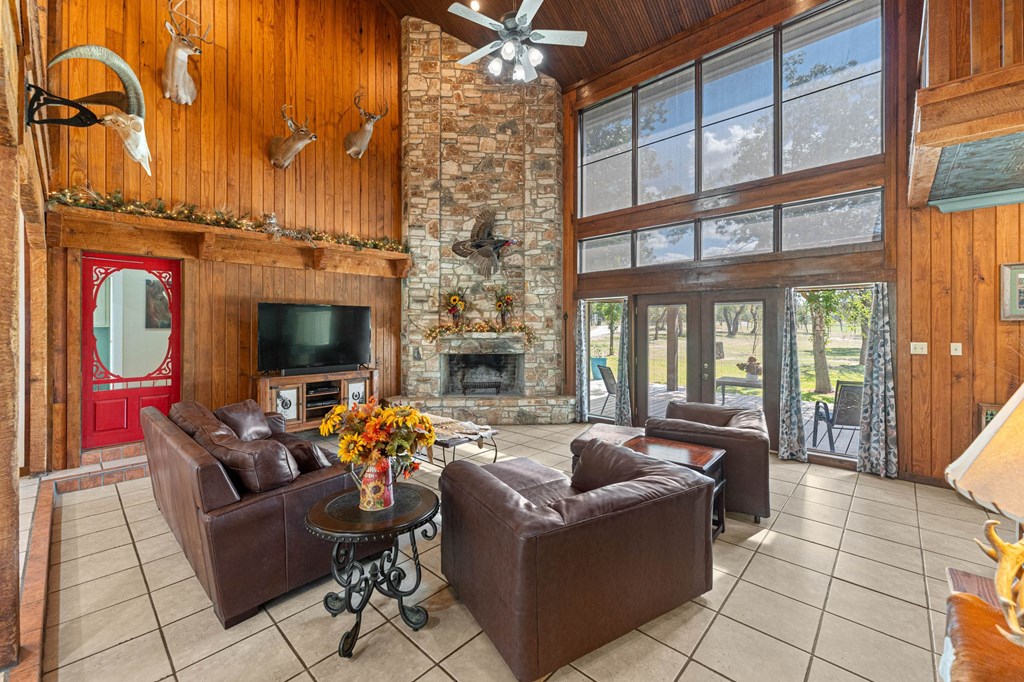 43 High Street Road Comfort, TX 78013 - Photo 30 of 90 a living room with fireplace furniture and a flat screen tv