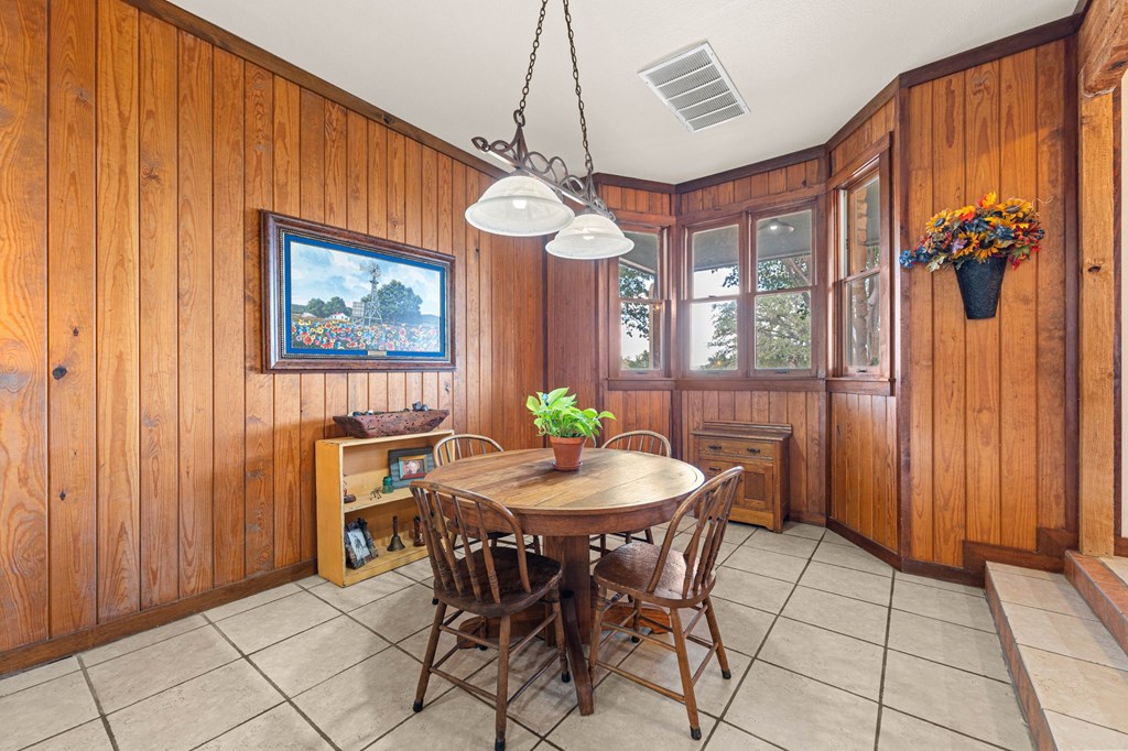 43 High Street Road Comfort, TX 78013 - Photo 39 of 90 a dining room with furniture a chandelier and wooden floor