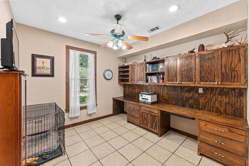 43 High Street Road Comfort, TX 78013 - Photo 40 of 90 a kitchen with stainless steel appliances kitchen island granite countertop a refrigerator and a stove top oven