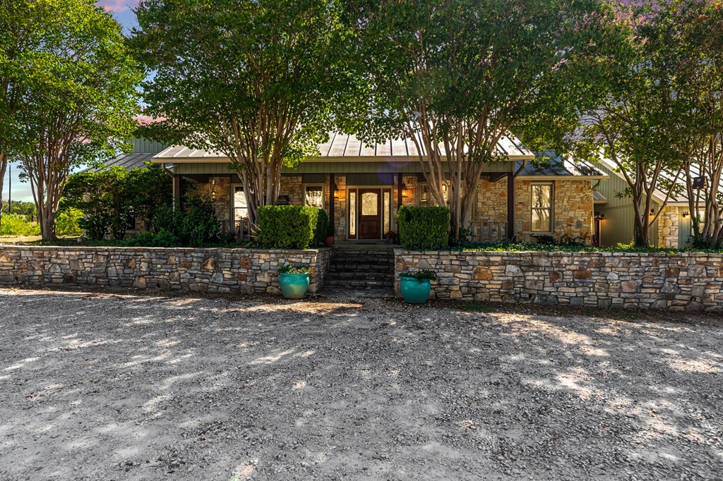 43 High Street Road Comfort, TX 78013 - Photo 4 of 90 a front view of a house with a yard and tree s