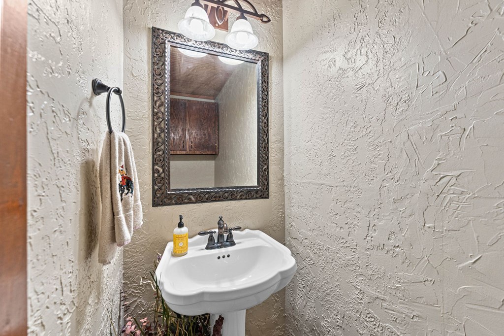 43 High Street Road Comfort, TX 78013 - Photo 49 of 90 a bathroom with a sink and a mirror
