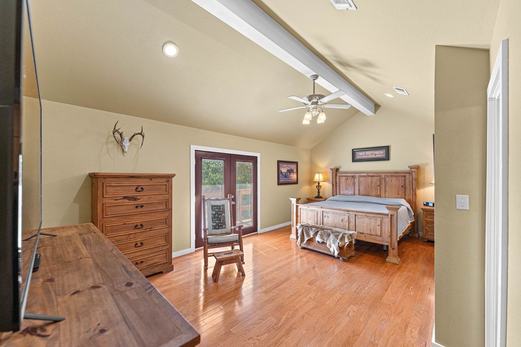 43 High Street Road Comfort, TX 78013 - Photo 52 of 90 a bedroom with furniture and wooden floor