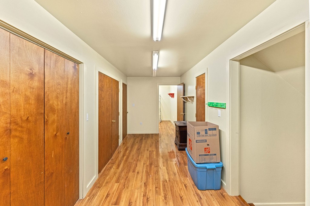 43 High Street Road Comfort, TX 78013 - Photo 88 of 90 a view of a hallway with wooden floor and furniture