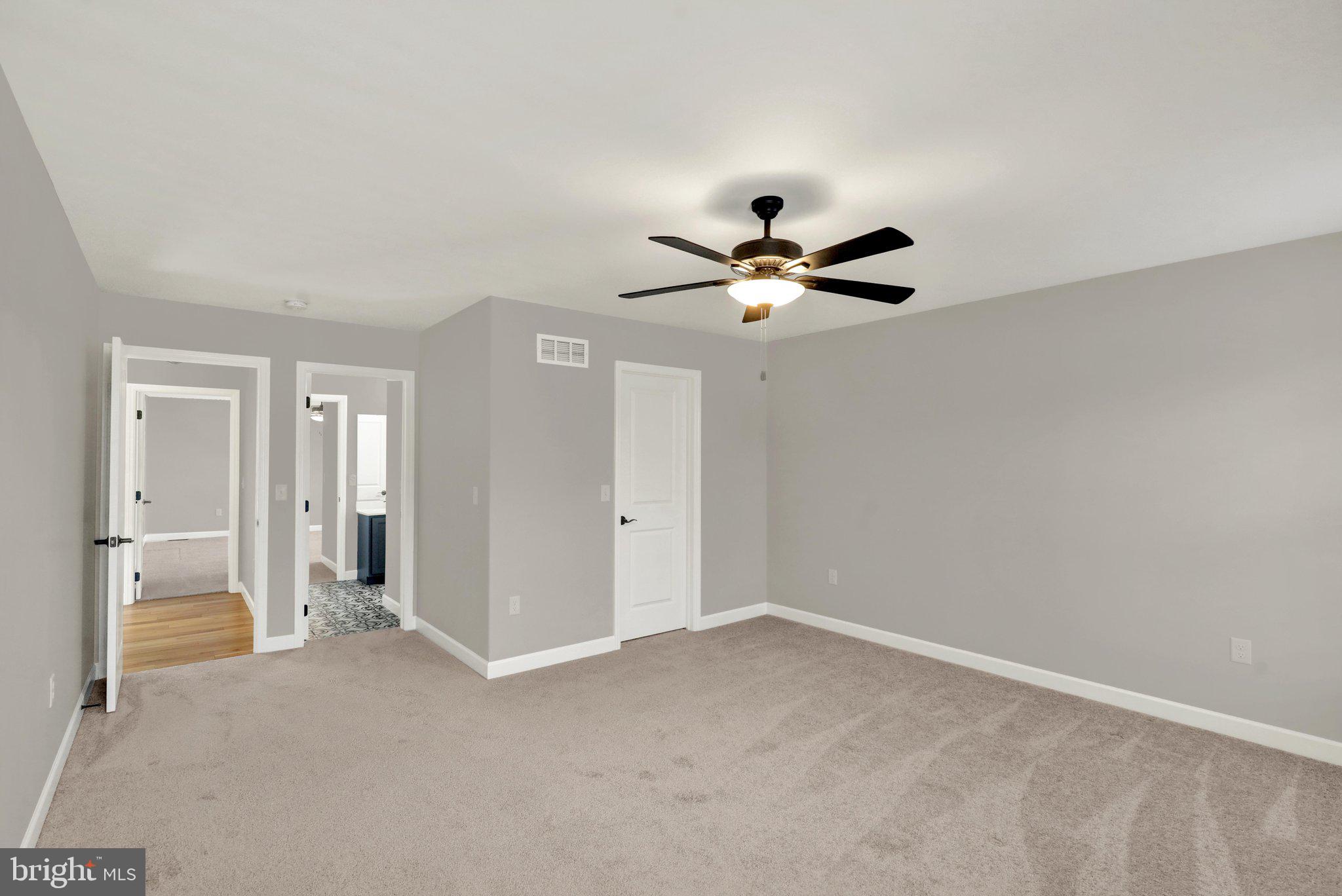 64 Middletown Road Fleetwood, PA 19522 - Photo 38 of 54 a view of a livingroom with a ceiling fan and wooden floor