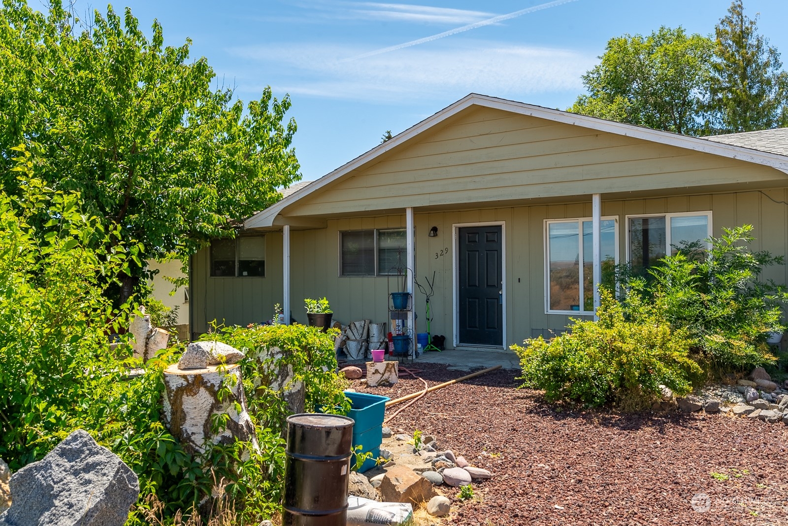 329 Maringo Road Ephrata, WA 98823 - Photo 1 of 18 a front view of house with yard