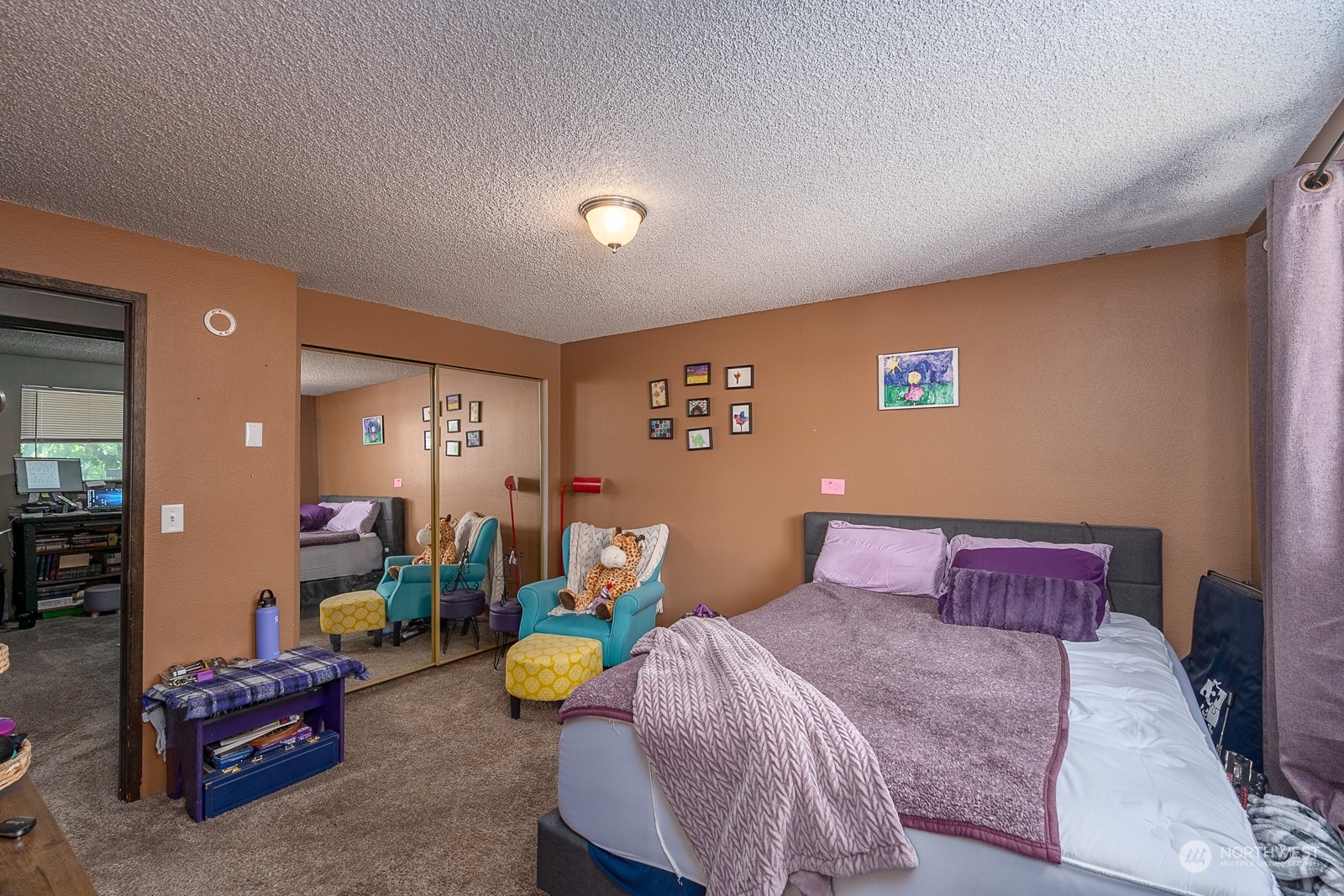 329 Maringo Road Ephrata, WA 98823 - Photo 14 of 18 a bedroom with a bed and a chandelier