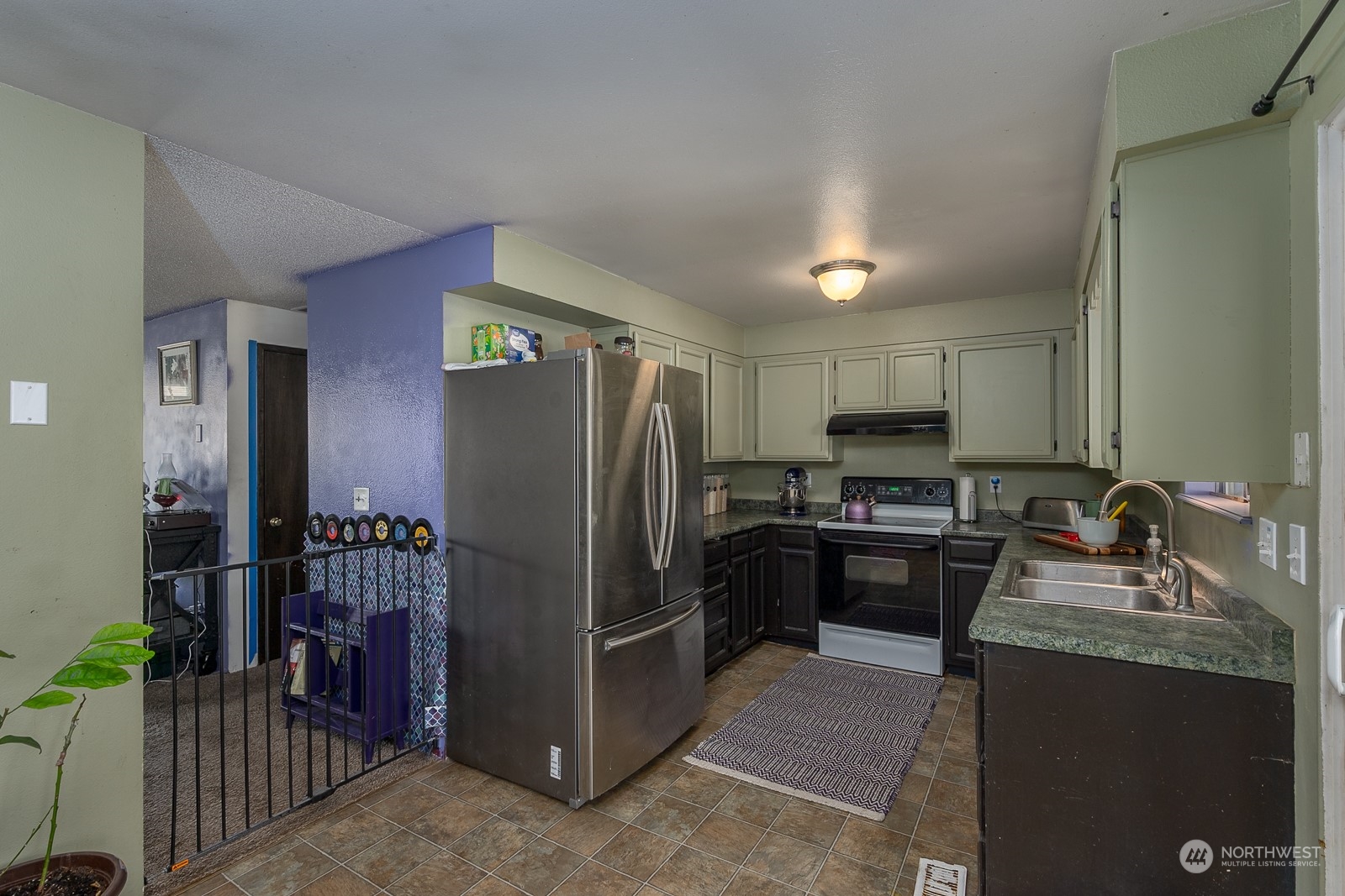 329 Maringo Road Ephrata, WA 98823 - Photo 8 of 18 a kitchen with stainless steel appliances granite countertop a refrigerator stove and sink