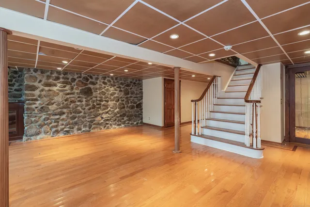 a view of an empty room with stairs