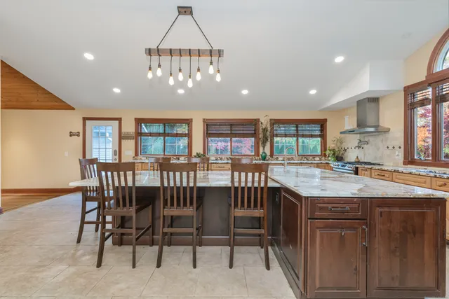 a kitchen with a table and chairs in it