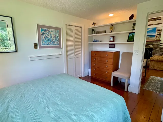 a bedroom with a bed and furniture