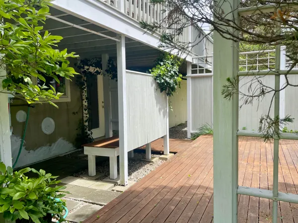 a living room with furniture and a mirror