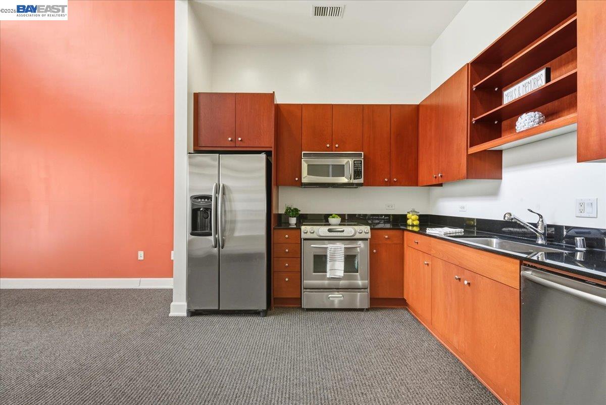 809 Clay Street Oakland, CA 94607 - Photo 1 of 39 a kitchen with stainless steel appliances granite countertop a refrigerator and a stove top oven