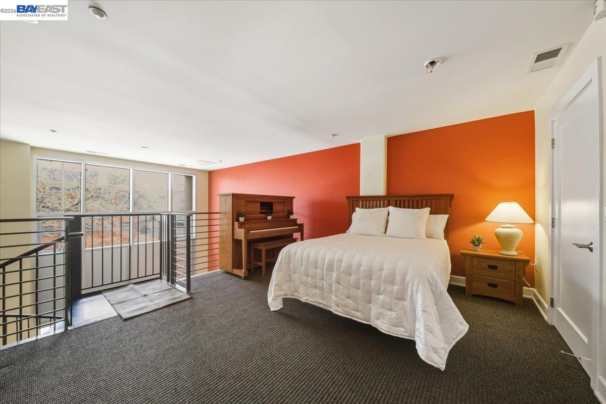 809 Clay Street Oakland, CA 94607 - Photo 16 of 39 a bedroom with bed and window