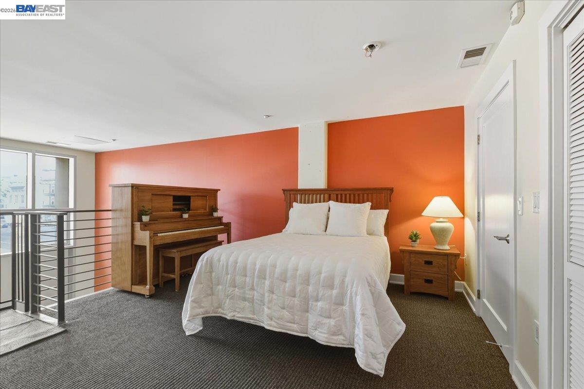 809 Clay Street Oakland, CA 94607 - Photo 17 of 39 a bedroom with a bed and dresser