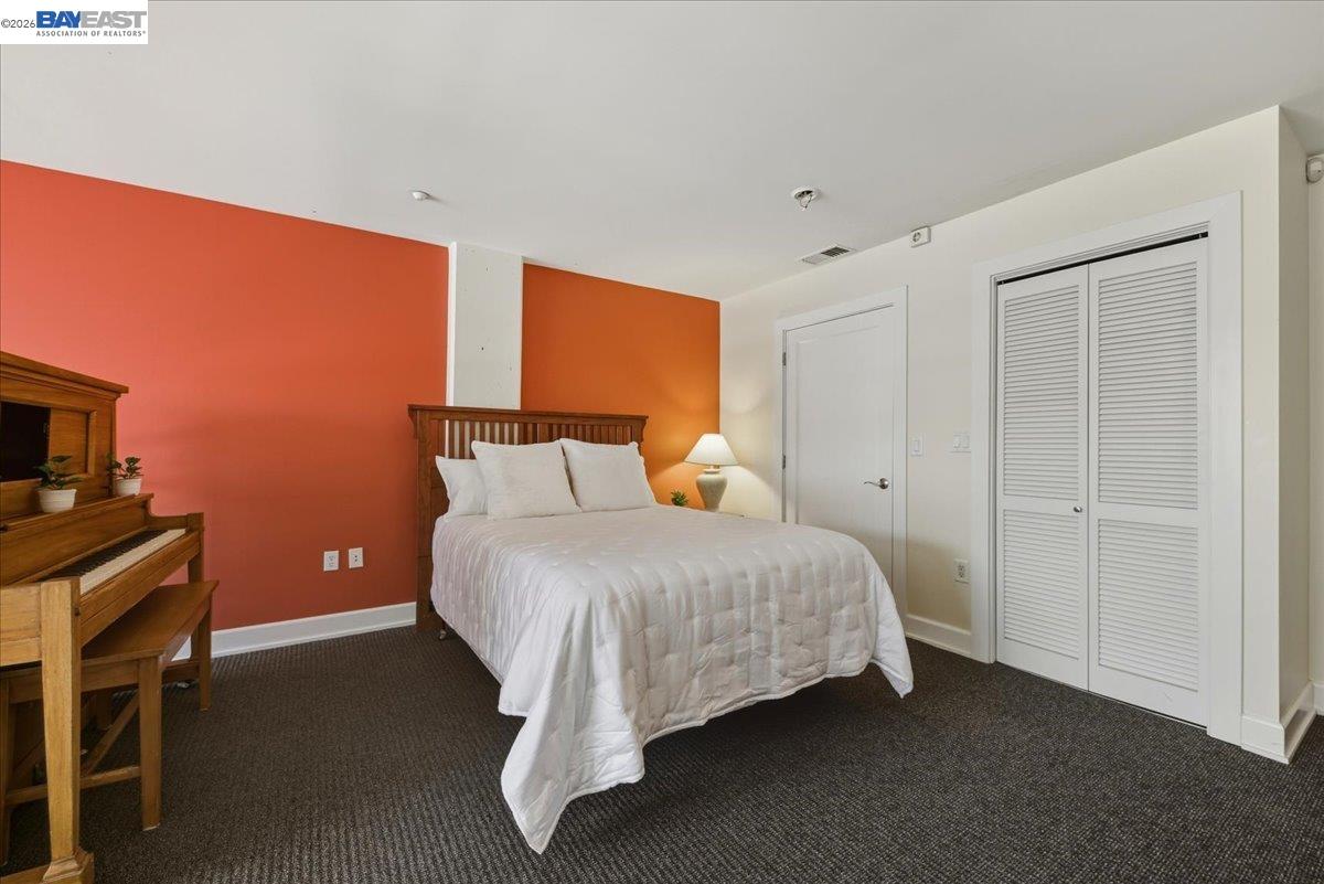 809 Clay Street Oakland, CA 94607 - Photo 18 of 39 a bedroom with a bed and a table in it