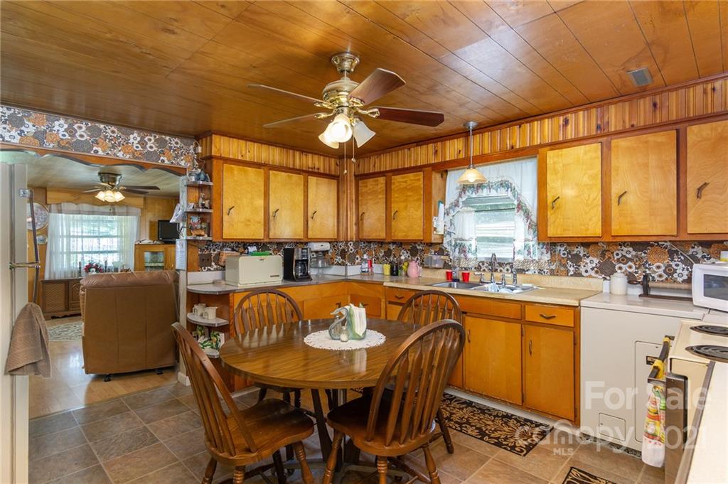 10200 Highway 23 Cheboygan, MI 49721 - Photo 11 of 14 a view of a dining room with furniture window and outside view