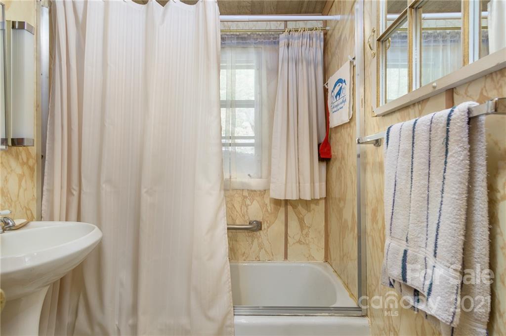 10200 Highway 23 Cheboygan, MI 49721 - Photo 14 of 14 a bathroom with a shower curtain and a sink