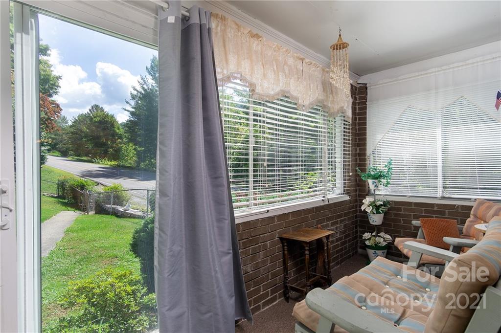 10200 Highway 23 Cheboygan, MI 49721 - Photo 6 of 14 a view of a porch with furniture and garden