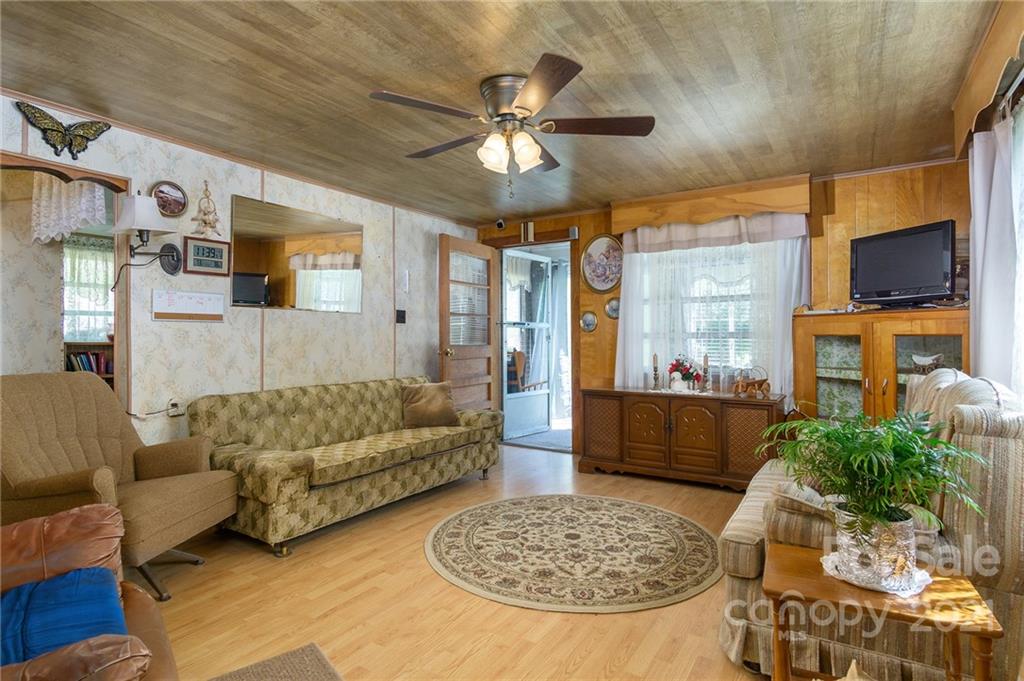 10200 Highway 23 Cheboygan, MI 49721 - Photo 8 of 14 a living room with furniture and a flat screen tv