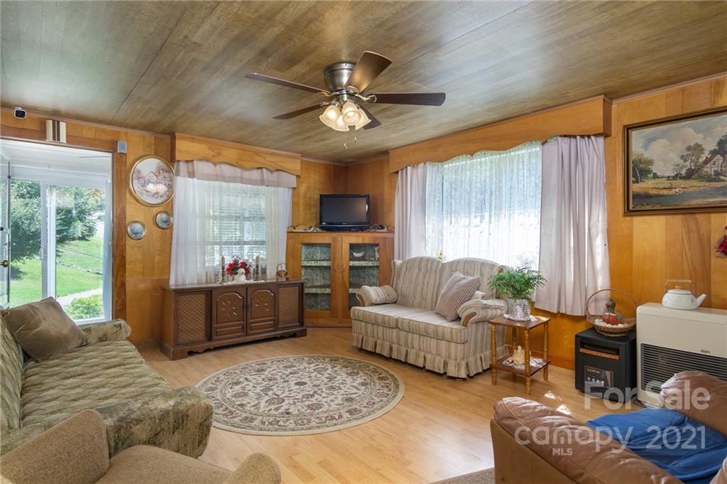 10200 Highway 23 Cheboygan, MI 49721 - Photo 9 of 14 a living room with furniture and a large window