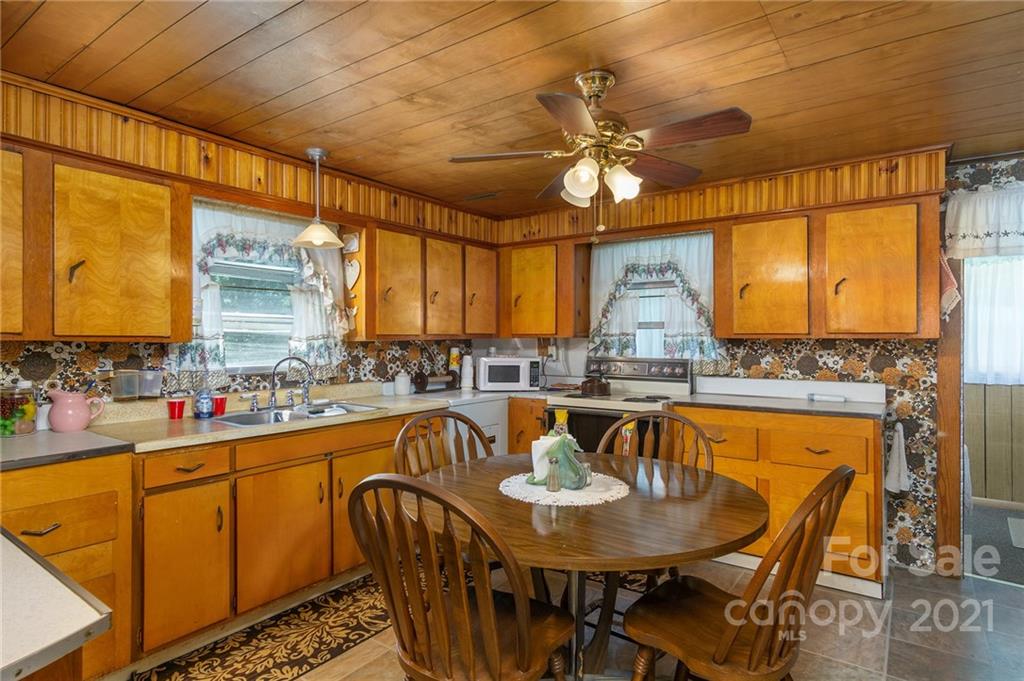 10200 Highway 23 Cheboygan, MI 49721 - Photo 10 of 14 a dining table with chairs and window