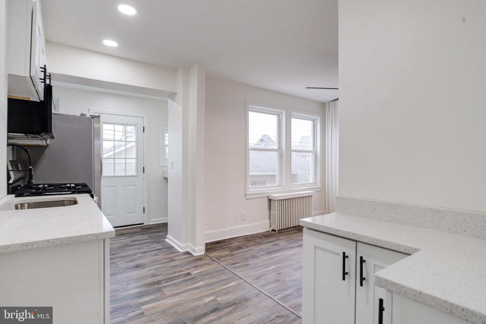44 Shipway Baltimore, MD 21222 - Photo 20 of 53 a kitchen with cabinets and wooden floor