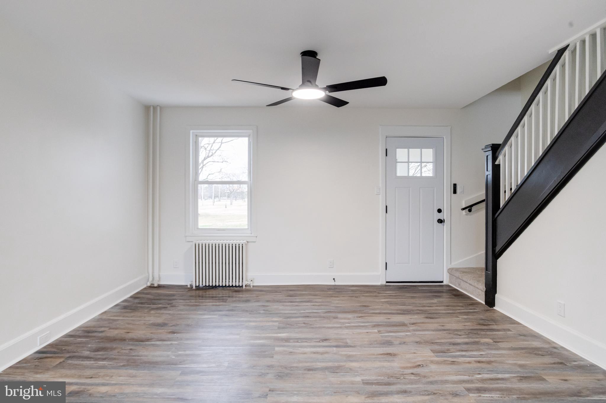 44 Shipway Baltimore, MD 21222 - Photo 6 of 53 a view of empty room with wooden floor and fan
