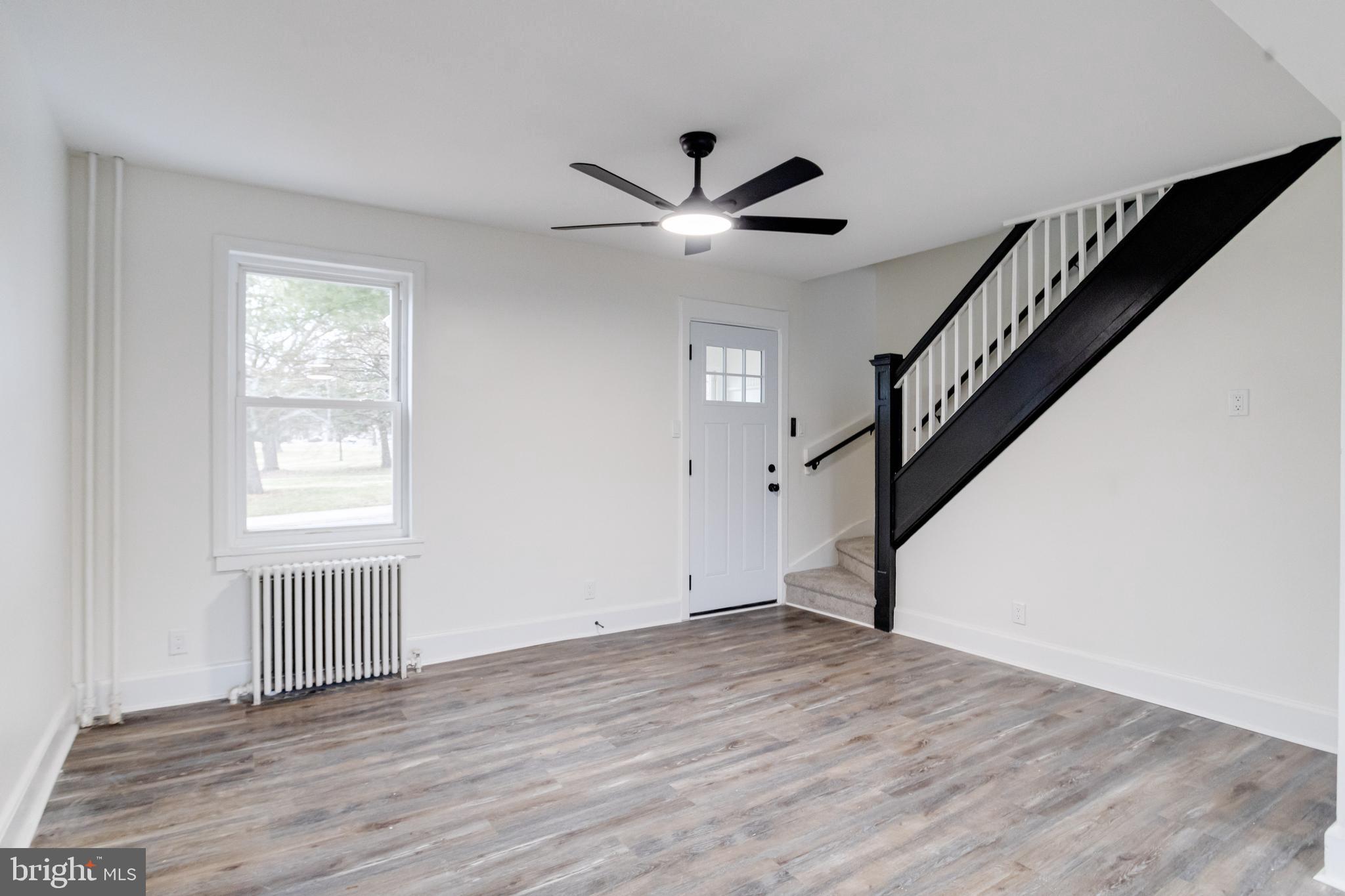 44 Shipway Baltimore, MD 21222 - Photo 7 of 53 a view of empty room with wooden floor and fan