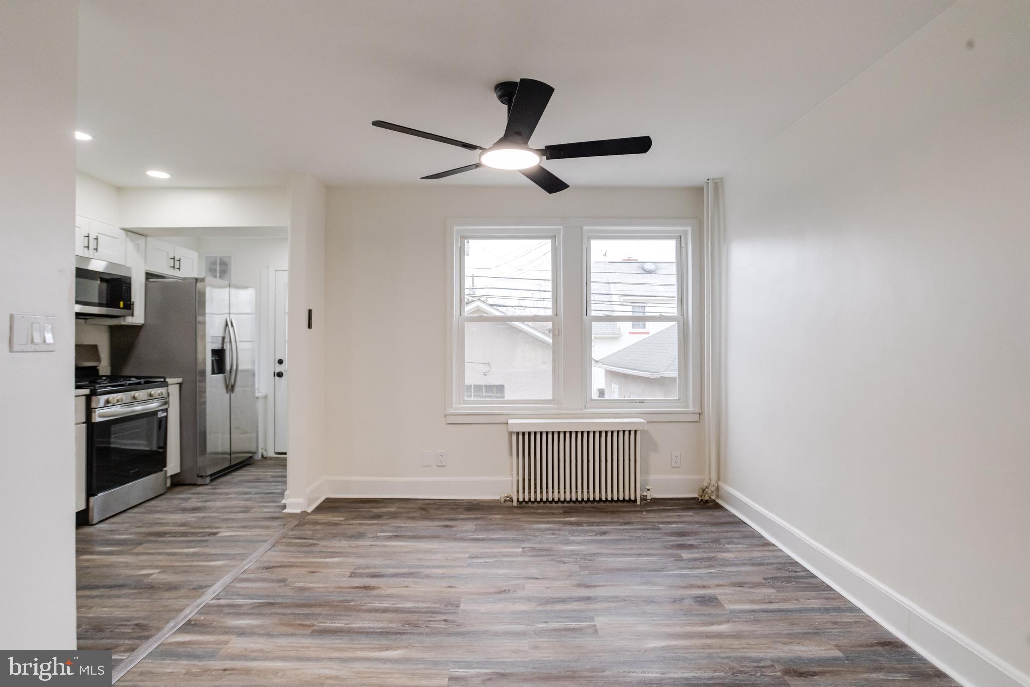44 Shipway Baltimore, MD 21222 - Photo 10 of 53 a view of empty room with wooden floor and fan
