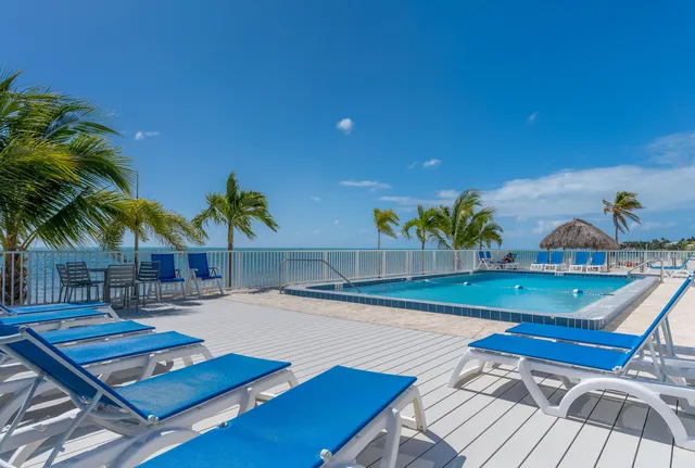 a view of a patio with swimming pool