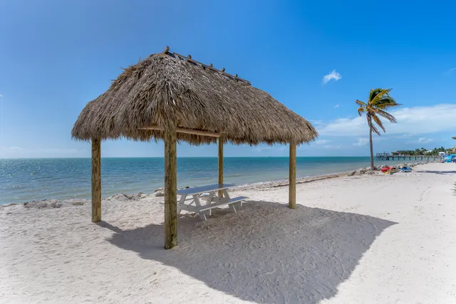 a swimming pool with an outdoor seating