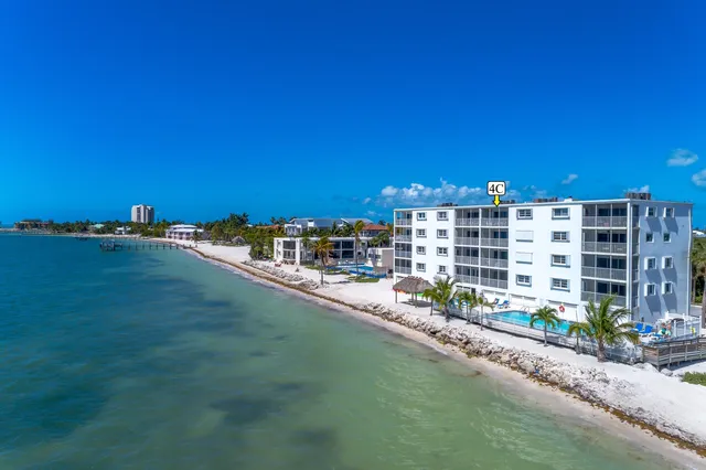 a swimming pool with outdoor seating and yard