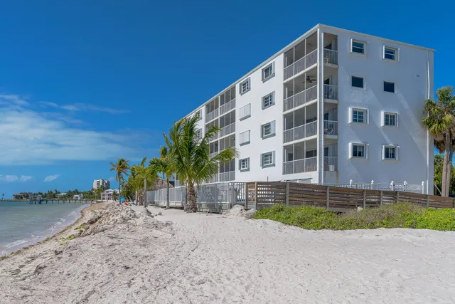 a view of a tall building with a yard
