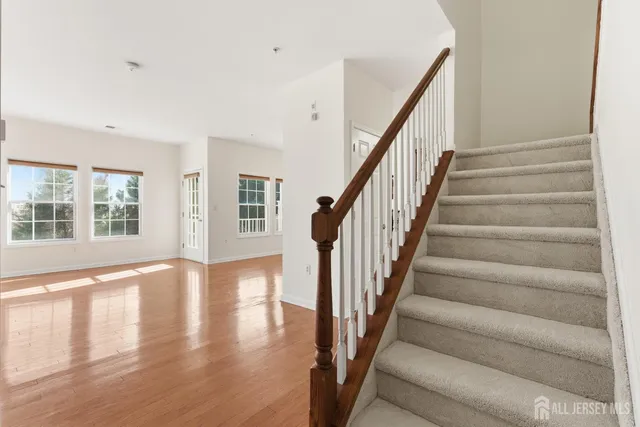a view of an entryway with wooden floor