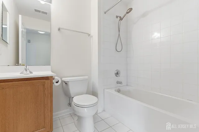 a bathroom with a toilet sink and shower